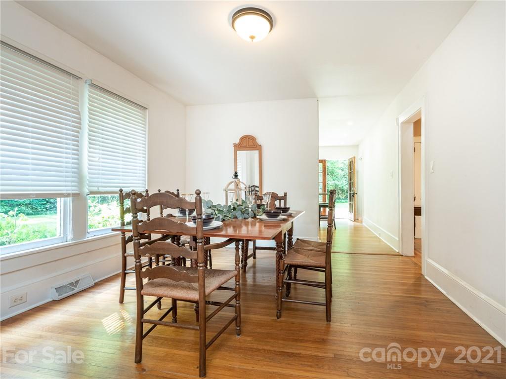 3514 Kelly Road Charlotte, NC 28216 - Photo 17 of 34 a view of a dining room with furniture and wooden floor