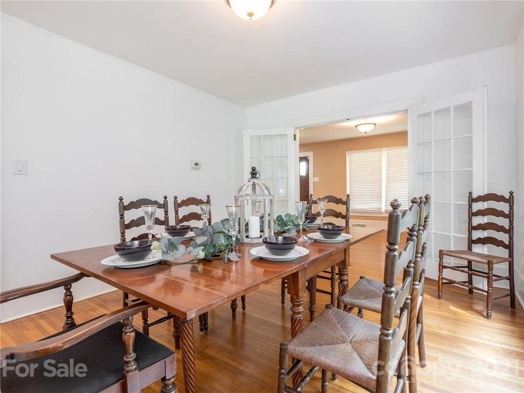 3514 Kelly Road Charlotte, NC 28216 - Photo 18 of 34 a view of a dining room with furniture and wooden floor