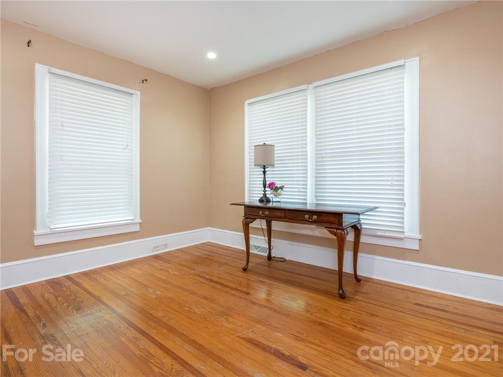 3514 Kelly Road Charlotte, NC 28216 - Photo 20 of 34 a view of an empty room with a window and wooden floor