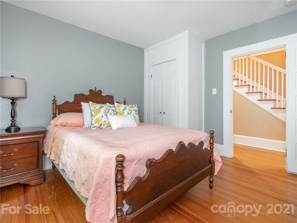 3514 Kelly Road Charlotte, NC 28216 - Photo 22 of 34 a bed sitting in a bedroom next to a window