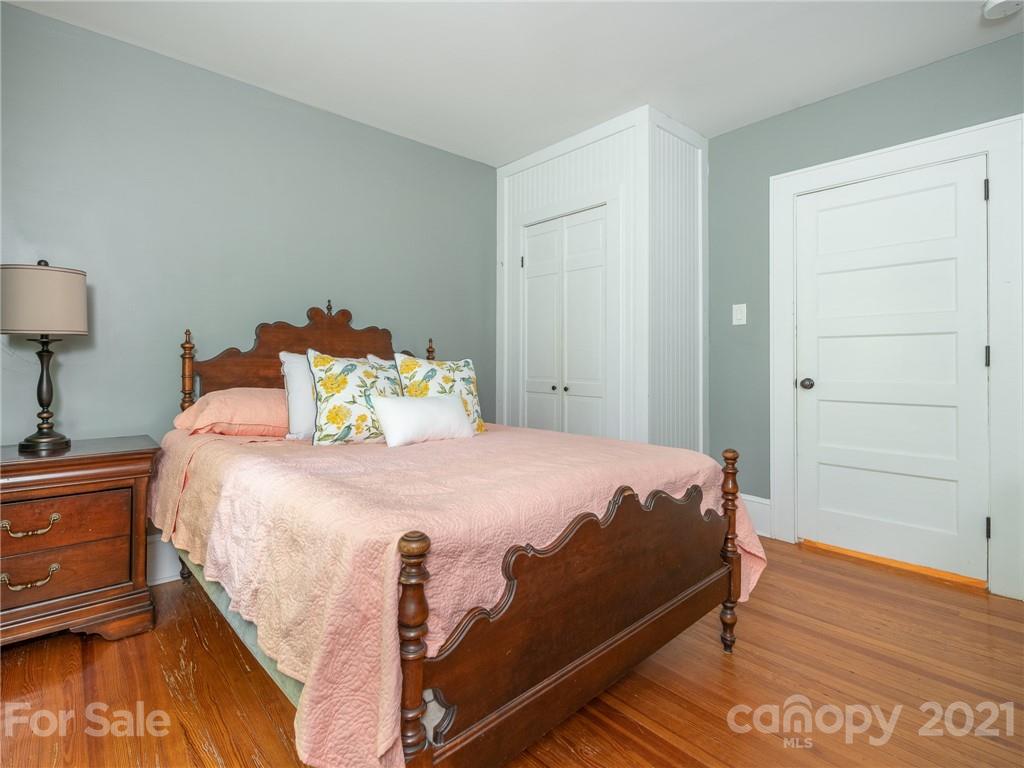 3514 Kelly Road Charlotte, NC 28216 - Photo 23 of 34 a bed sitting in a bedroom next to a cabinet