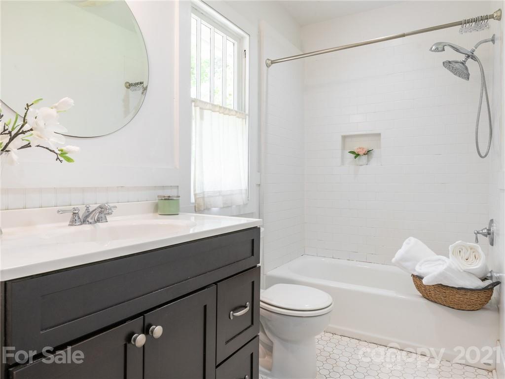 3514 Kelly Road Charlotte, NC 28216 - Photo 24 of 34 a bathroom with a sink a toilet and shower