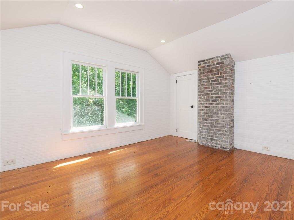 3514 Kelly Road Charlotte, NC 28216 - Photo 27 of 34 an empty room with wooden floor and windows