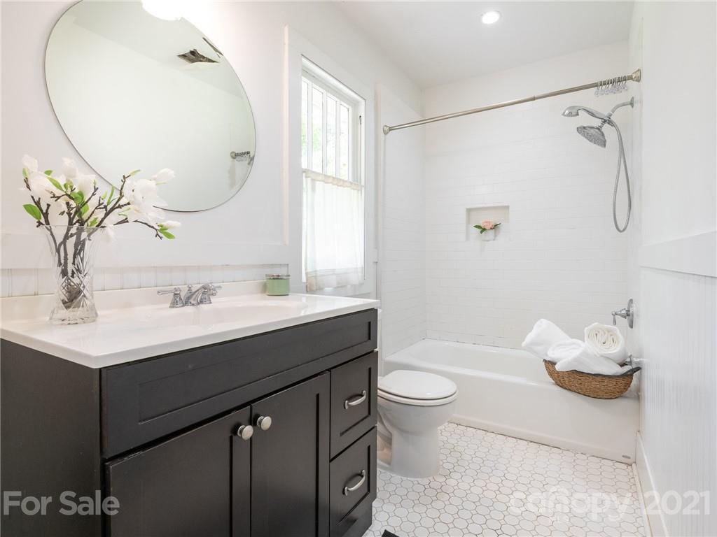 3514 Kelly Road Charlotte, NC 28216 - Photo 5 of 34 a bathroom with a sink toilet and shower