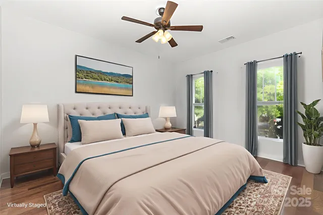 a bedroom with bed and window