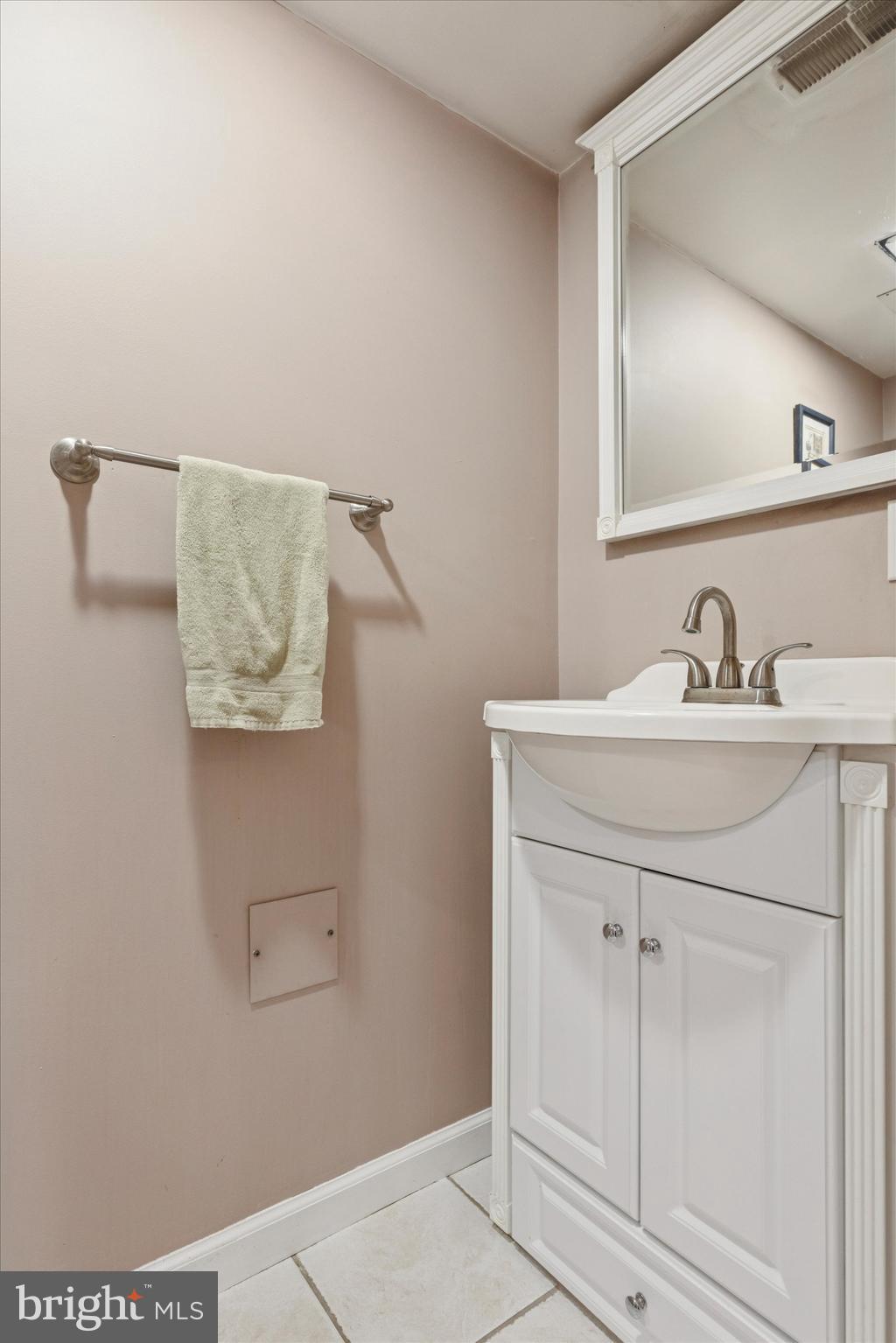 4114 Pilgrim Road Plymouth Meeting, PA 19462 - Photo 15 of 36 a bathroom with a sink and a mirror