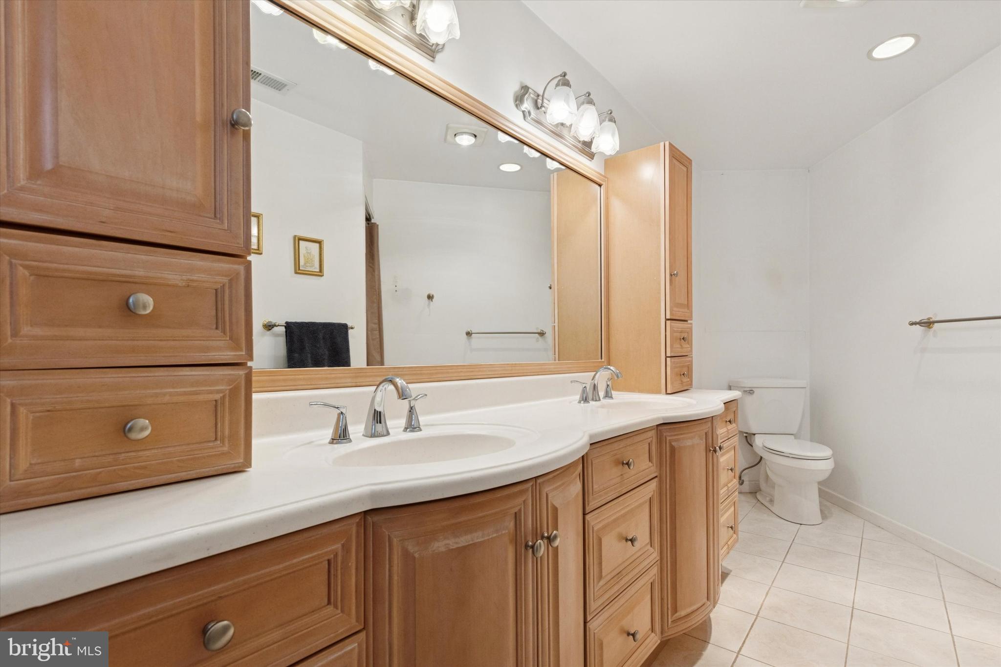 4114 Pilgrim Road Plymouth Meeting, PA 19462 - Photo 20 of 36 a bathroom with a double vanity sink and mirror