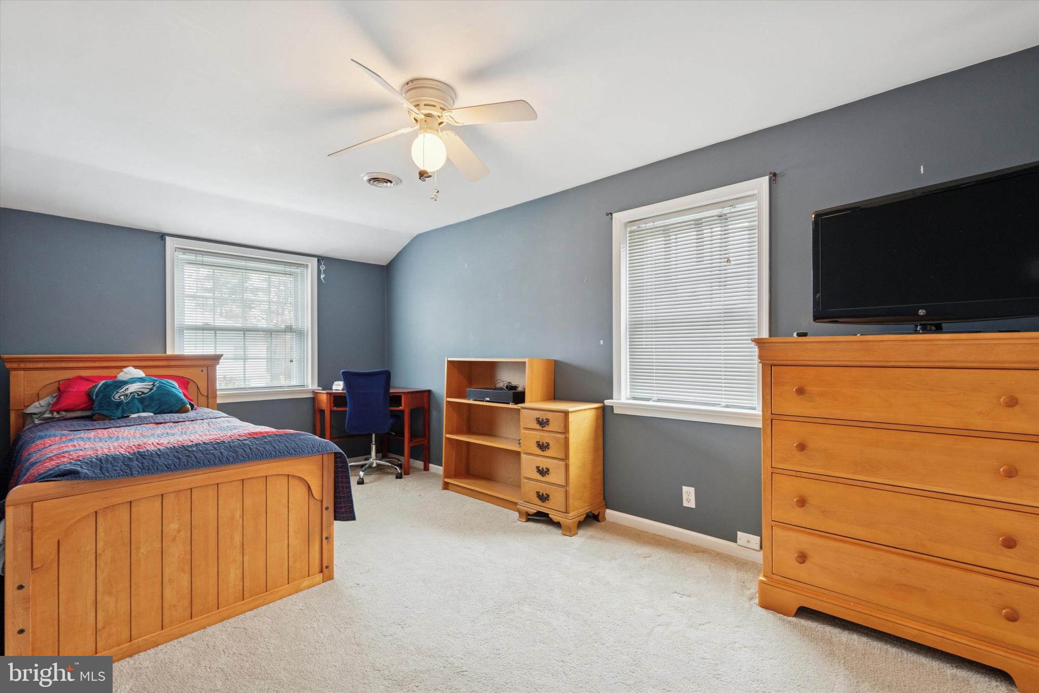 4114 Pilgrim Road Plymouth Meeting, PA 19462 - Photo 23 of 36 a bedroom with a bed and flat screen tv