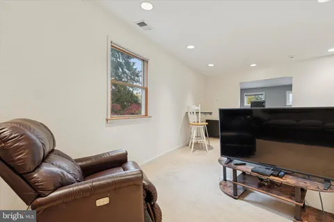 a bedroom with a bed and a desk