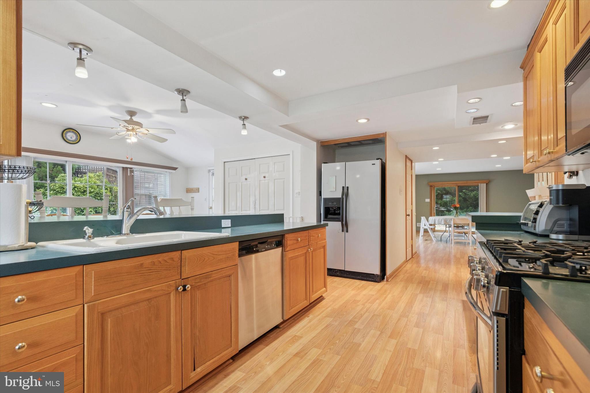 4114 Pilgrim Road Plymouth Meeting, PA 19462 - Photo 5 of 36 a large kitchen with stainless steel appliances granite countertop a lot of counter space and wooden floors