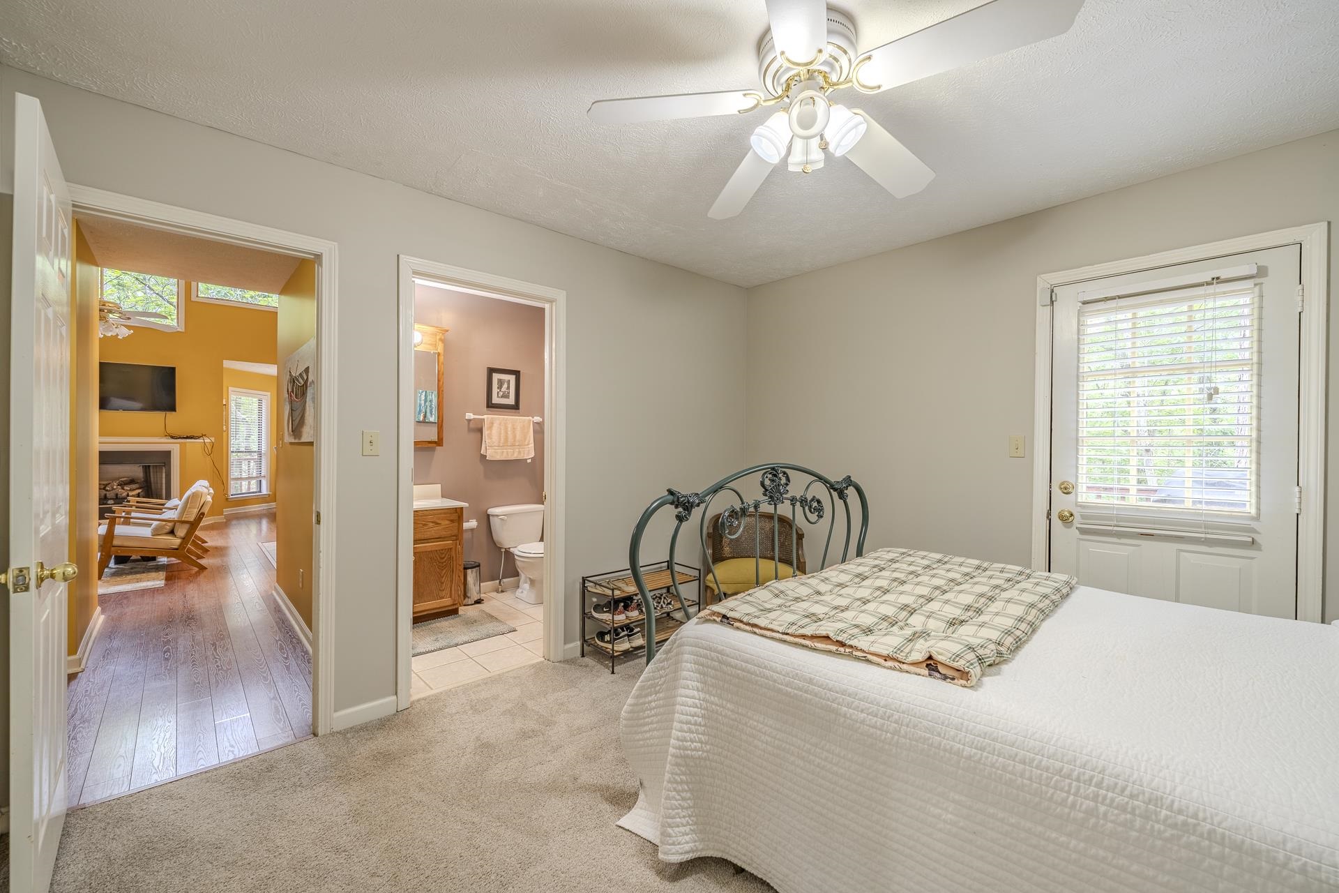 405 Murray Lane Counce, TN 38326 - Photo 20 of 36 a bedroom with a bed and a chandelier