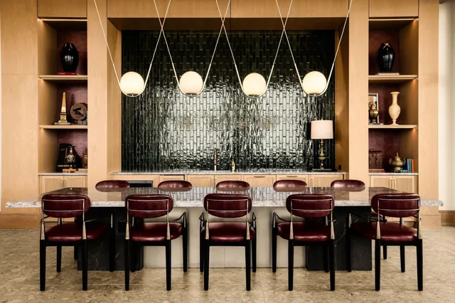 a dining area with furniture and window