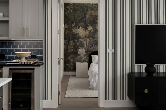 a kitchen with a refrigerator and a stove