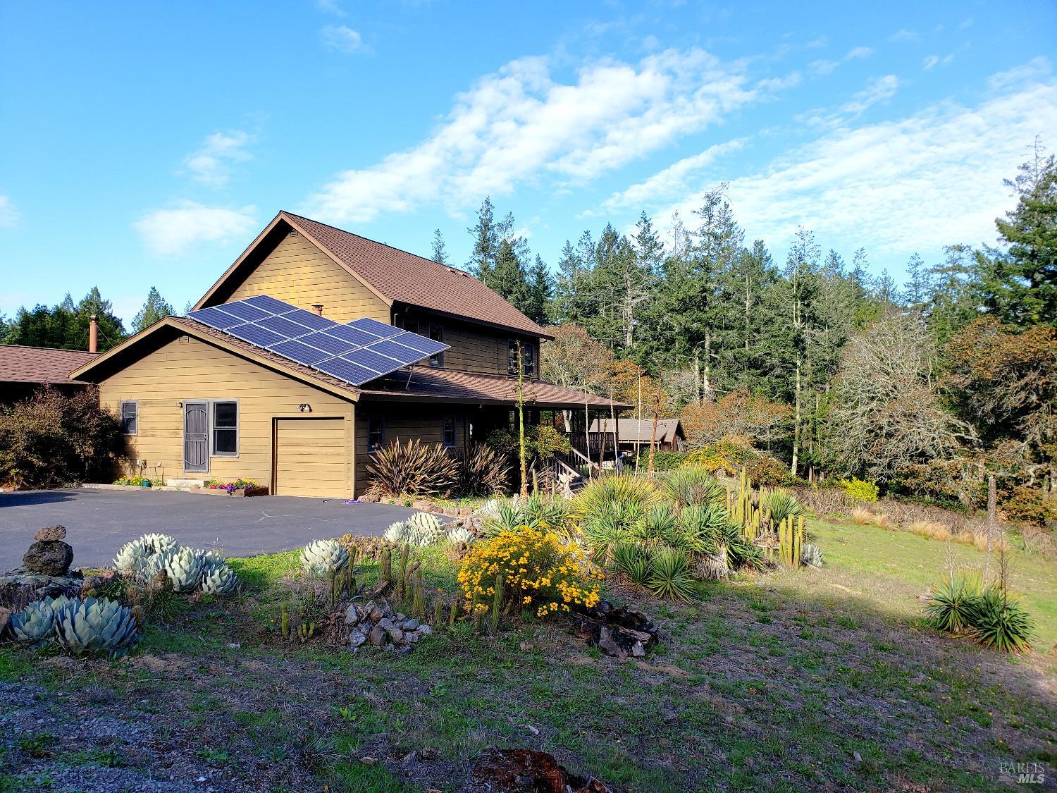 737 Jonive Road Sebastopol, CA 95472 - Photo 1 of 1 a front view of house with yard and trees around