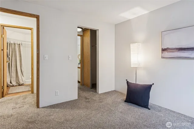 a view of an empty room with a fireplace