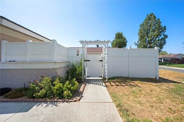 a kitchen with granite countertop cabinets stainless steel appliances a sink and window