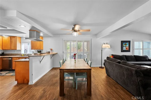 a large kitchen with stainless steel appliances granite countertop a stove and a sink