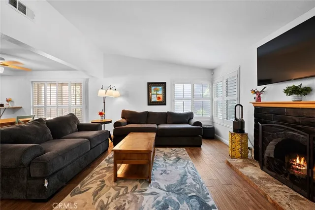 a spacious bedroom with a bed and a chandelier