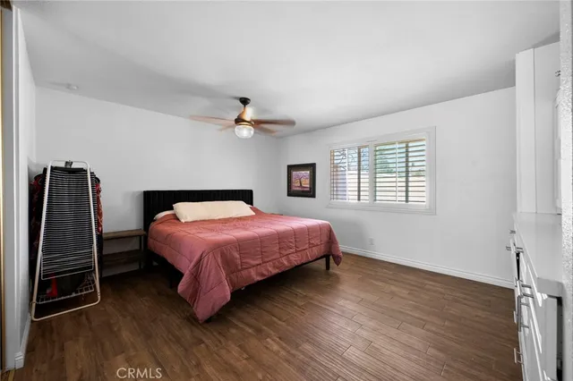 a bedroom with furniture and a window