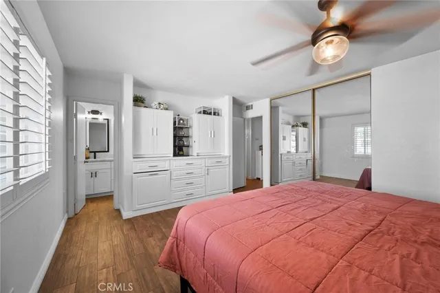 a bedroom with furniture and a window