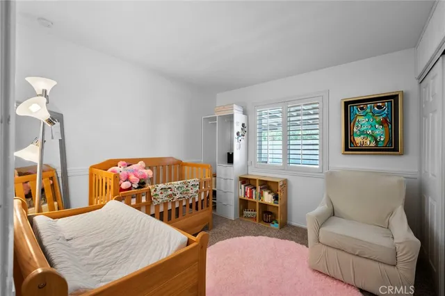 an aerial view of a houses with a yard