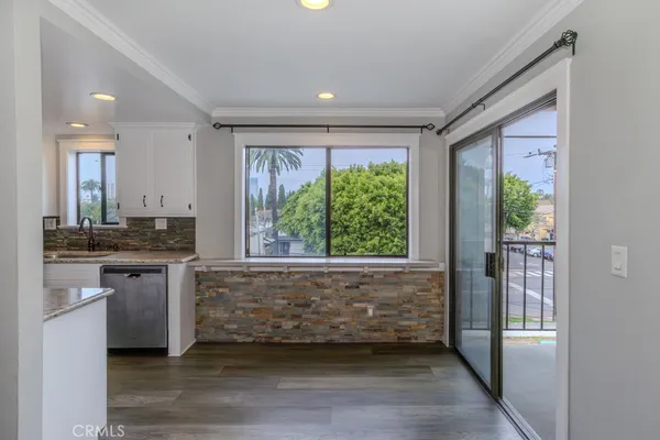 a view of a kitchen cabinets and a wooden floor