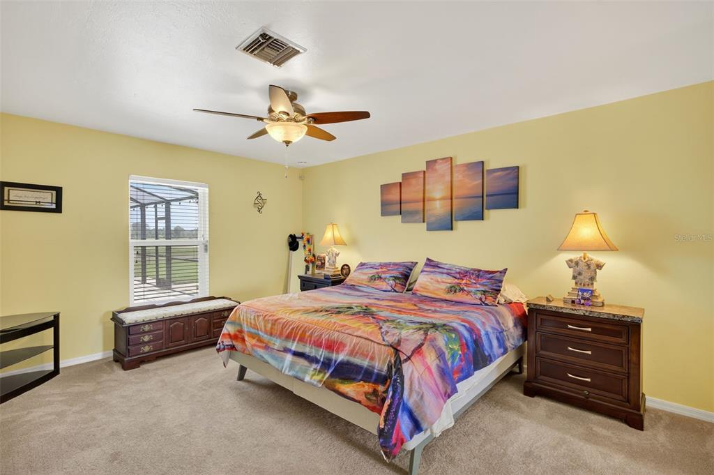 125 Paddock Street Lehigh Acres, FL 33974 - Photo 15 of 45 a bedroom with a bed and dresser