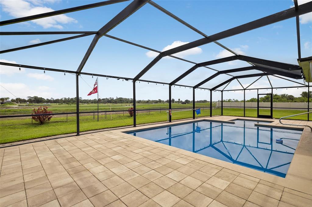 125 Paddock Street Lehigh Acres, FL 33974 - Photo 28 of 45 a view of outdoor space with swimming pool