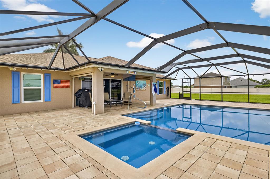 125 Paddock Street Lehigh Acres, FL 33974 - Photo 30 of 45 a view of swimming pool with seating area