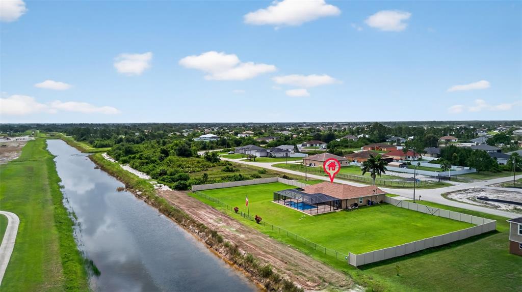 125 Paddock Street Lehigh Acres, FL 33974 - Photo 44 of 45 a view of a lake with a city