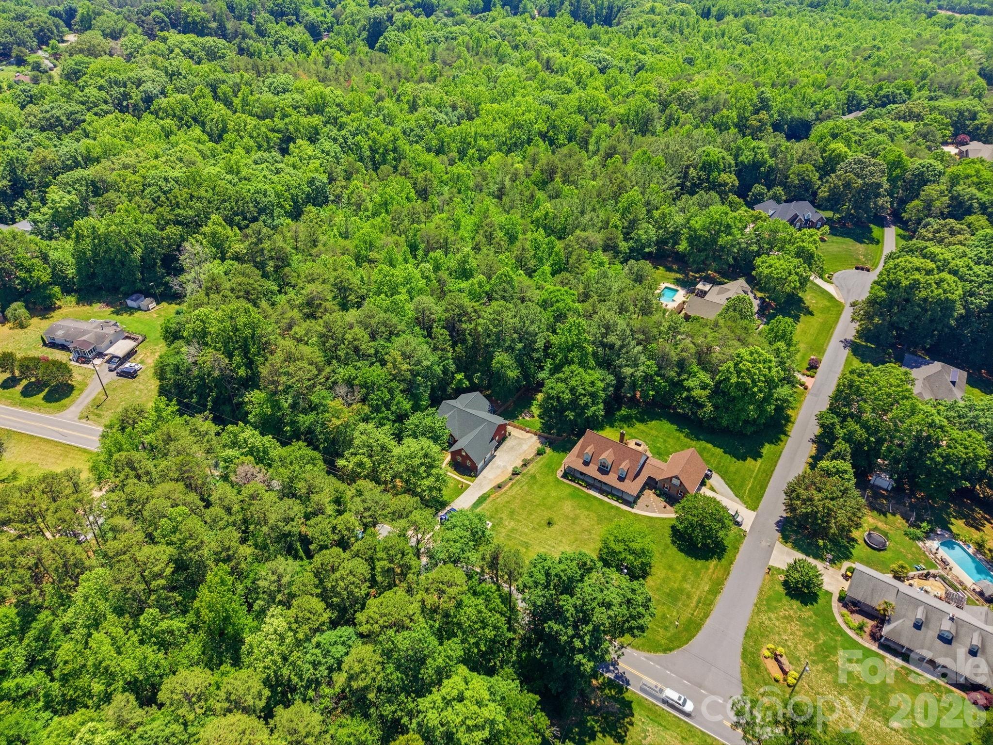 145 Upper Spencer Mountain Road Stanley, NC 28164 - Photo 29 of 29 an aerial view of a house with a yard