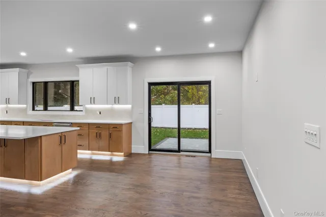 a open kitchen with a sink a stove and a refrigerator