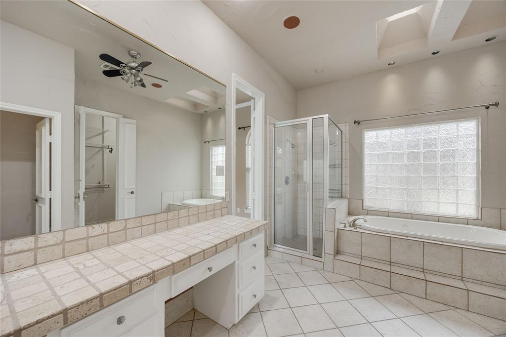 1201 Findlay Drive Arlington, TX 76012 - Photo 22 of 35 a bathroom with a granite countertop sink a large mirror and shower