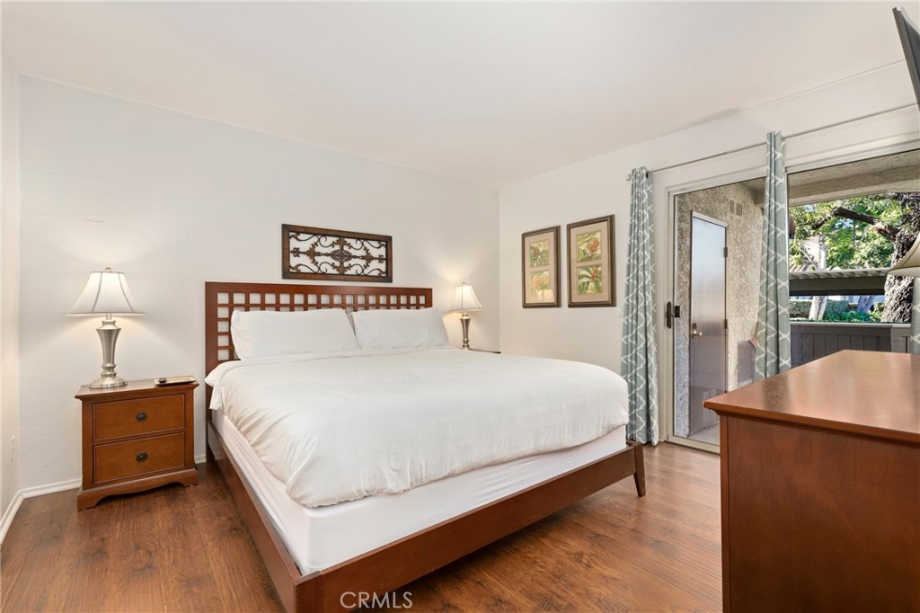 14 Corniche Drive, Unit A Dana Point, CA 92629 - Photo 14 of 49 a bedroom with a bed and a night stand