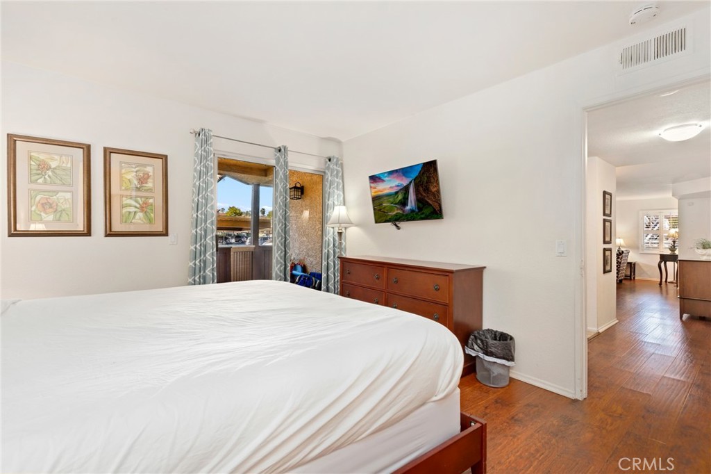 14 Corniche Drive, Unit A Dana Point, CA 92629 - Photo 16 of 49 a bedroom with a bed and a flat screen tv