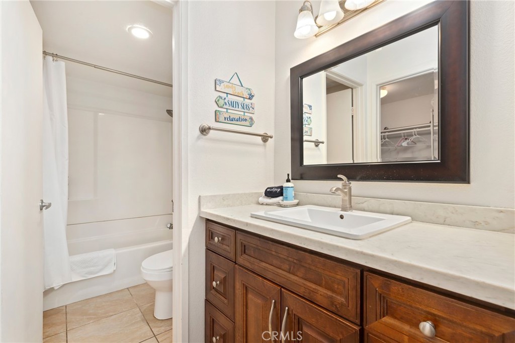 14 Corniche Drive, Unit A Dana Point, CA 92629 - Photo 18 of 49 a bathroom with a sink a toilet and shower