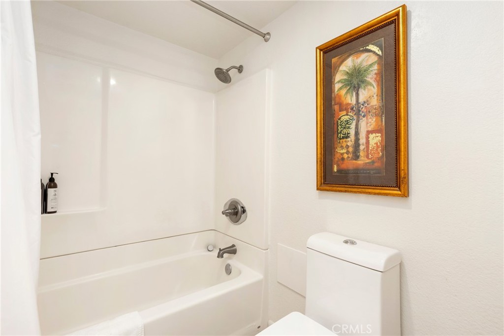 14 Corniche Drive, Unit A Dana Point, CA 92629 - Photo 19 of 49 a bathroom with a bathtub and a shower