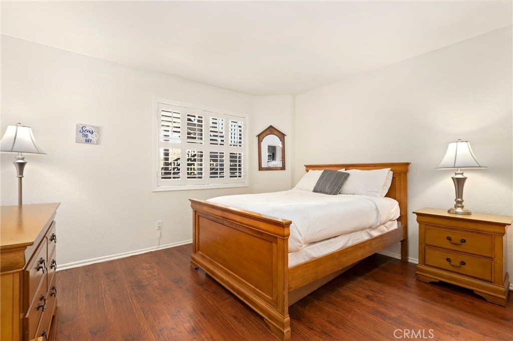 14 Corniche Drive, Unit A Dana Point, CA 92629 - Photo 20 of 49 a bedroom with a bed and a night stand