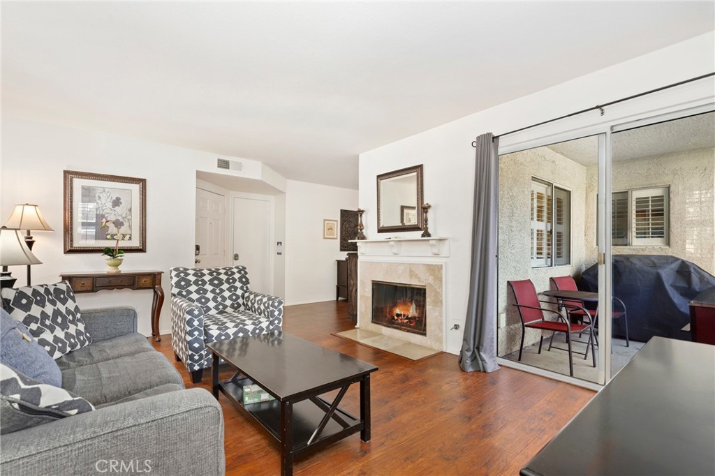 14 Corniche Drive, Unit A Dana Point, CA 92629 - Photo 2 of 49 a living room with furniture and a fireplace