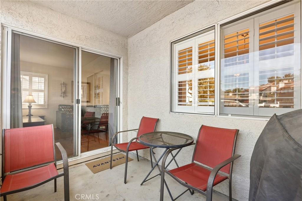 14 Corniche Drive, Unit A Dana Point, CA 92629 - Photo 25 of 49 a patio with a table and chairs