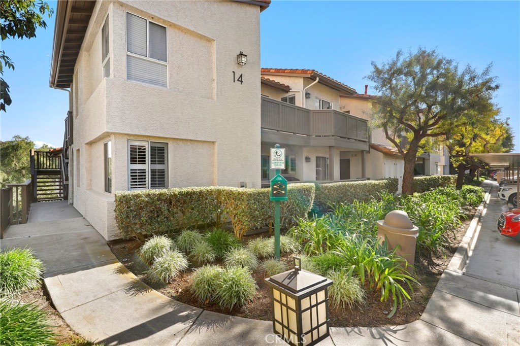 14 Corniche Drive, Unit A Dana Point, CA 92629 - Photo 29 of 49 a view of a patio with couches table and chairs and potted plants