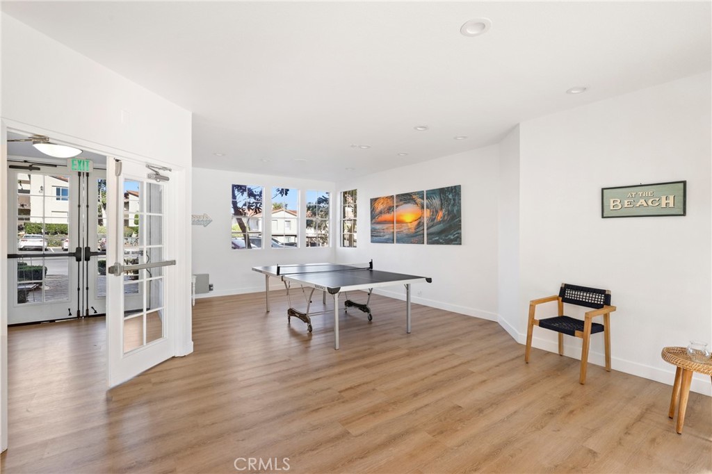 14 Corniche Drive, Unit A Dana Point, CA 92629 - Photo 34 of 49 a living room with furniture wooden floor and a flat screen tv