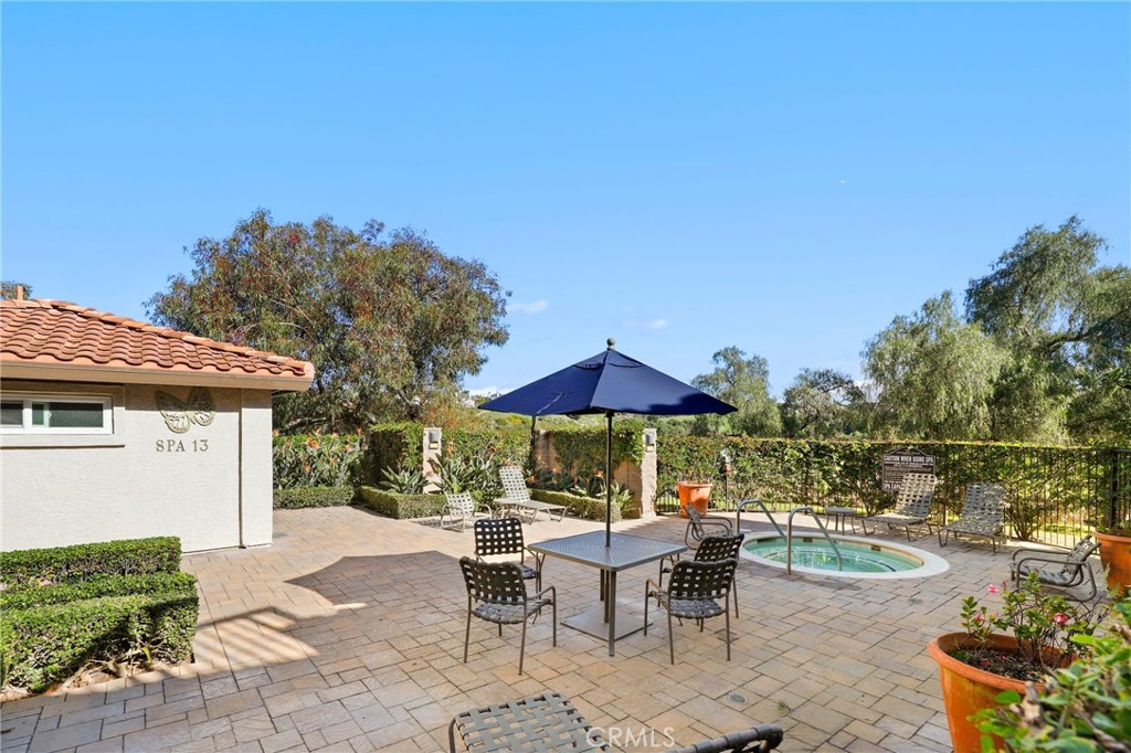14 Corniche Drive, Unit A Dana Point, CA 92629 - Photo 37 of 49 a view of a patio with couches under an umbrella