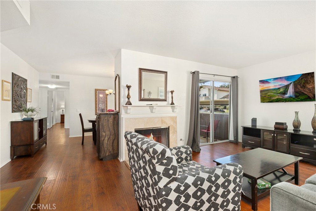 14 Corniche Drive, Unit A Dana Point, CA 92629 - Photo 4 of 49 a living room with furniture wooden floor and a flat screen tv