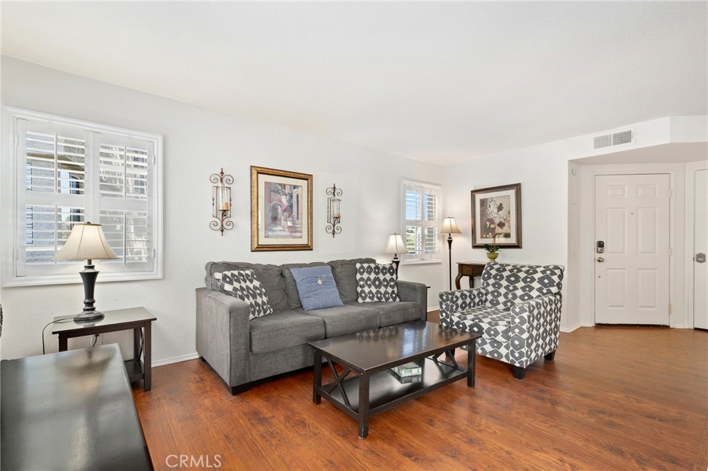 14 Corniche Drive, Unit A Dana Point, CA 92629 - Photo 5 of 49 a living room with furniture and a lamp