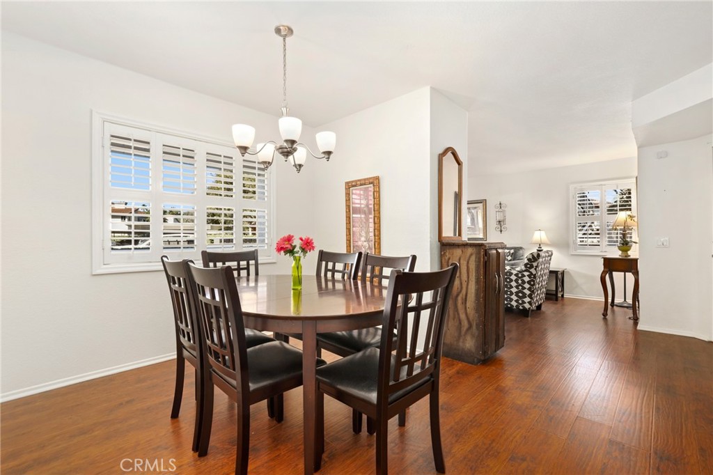 14 Corniche Drive, Unit A Dana Point, CA 92629 - Photo 8 of 49 a view of a dining room with furniture and wooden floor