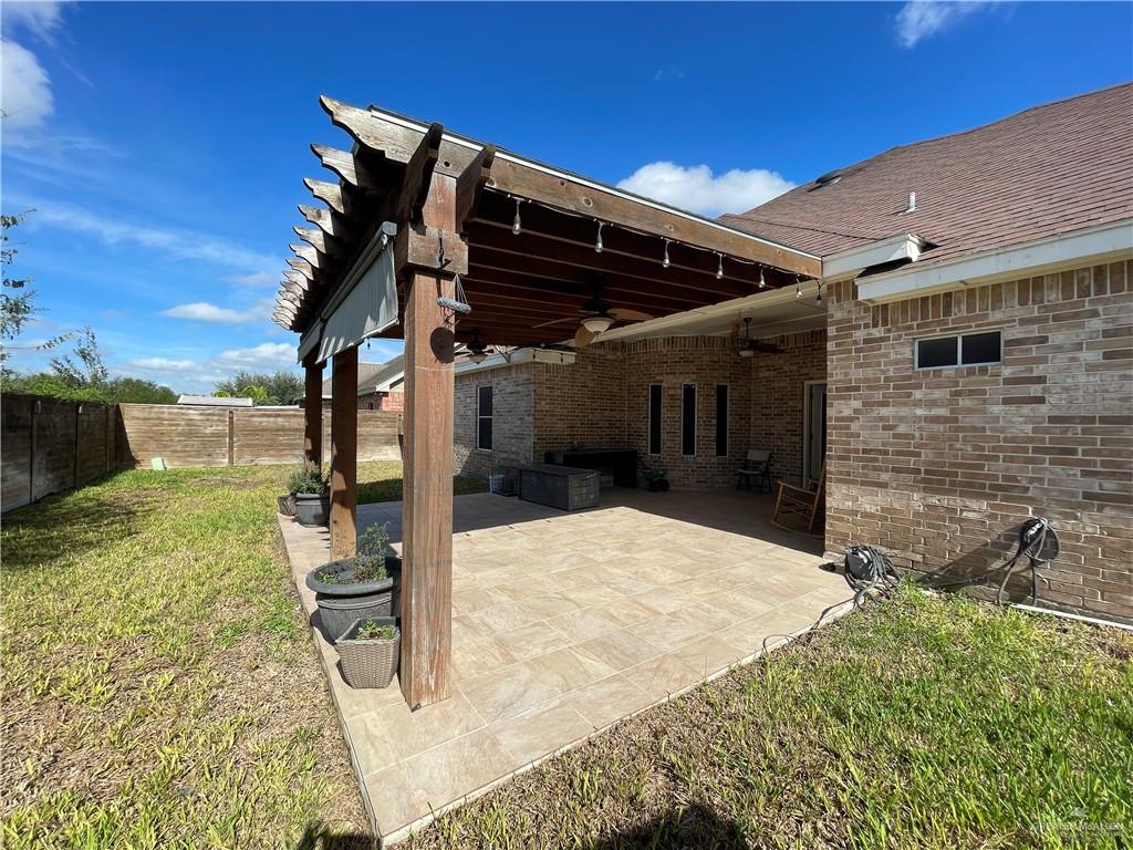 1000 South Flag Street Pharr, TX 78577 - Photo 19 of 24 front view of a house with a yard