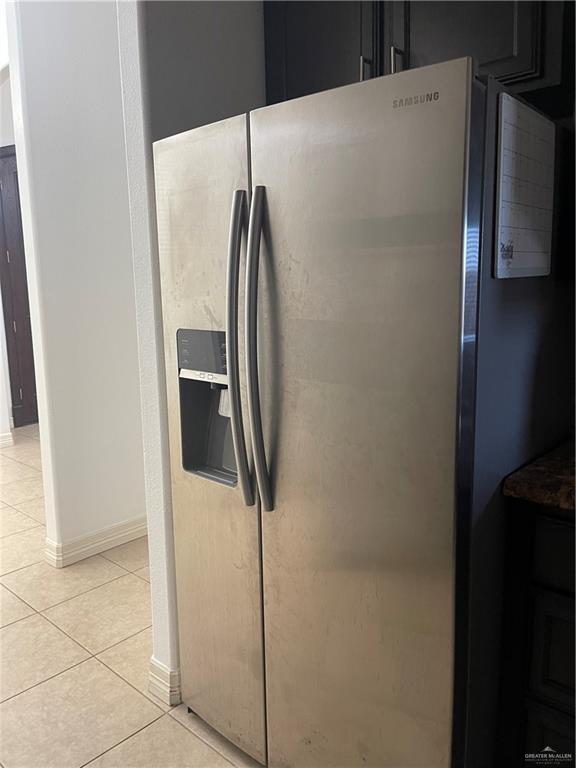 1000 South Flag Street Pharr, TX 78577 - Photo 24 of 24 a metallic refrigerator freezer sitting in a kitchen