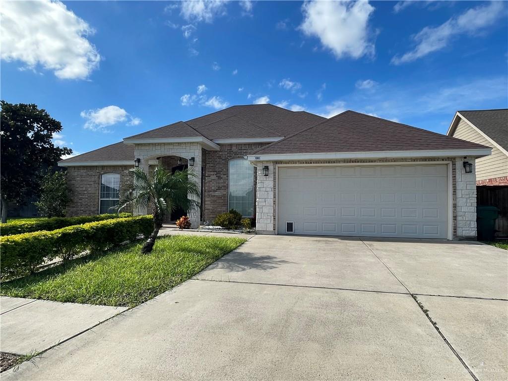 1000 South Flag Street Pharr, TX 78577 - Photo 3 of 24 a front view of house with yard and green space