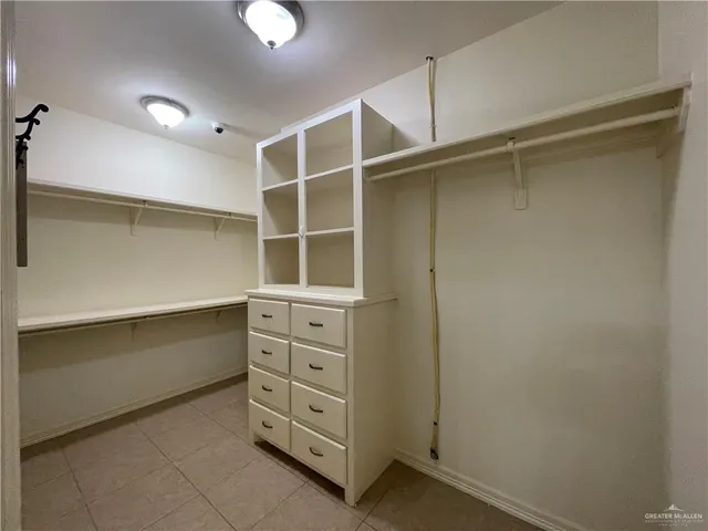 a view of an empty walk in closet